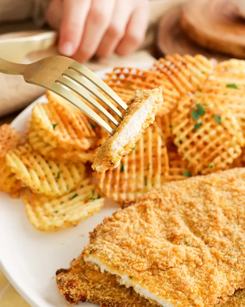 milanesa de pollo con papas rejilla